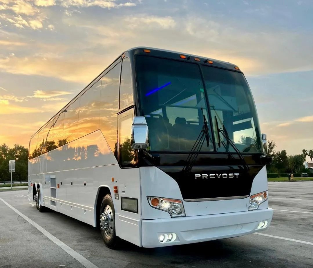 A man walking across a street next to a car