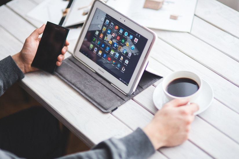 A woman at her desk working on compliance services from Harrison Media Solutions