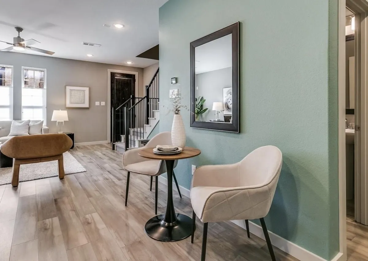 Cozy dining nook and seating area located off the kitchen and living room, professionally staged by Model My Home—Dallas Fort Worth home staging and interior design experts.