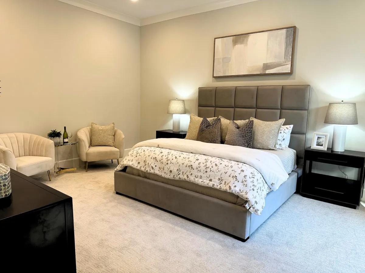 Spacious secondary bedroom comfortably fitting a queen bed, professionally staged by Model My Home—Dallas Fort Worth home staging and interior design experts.