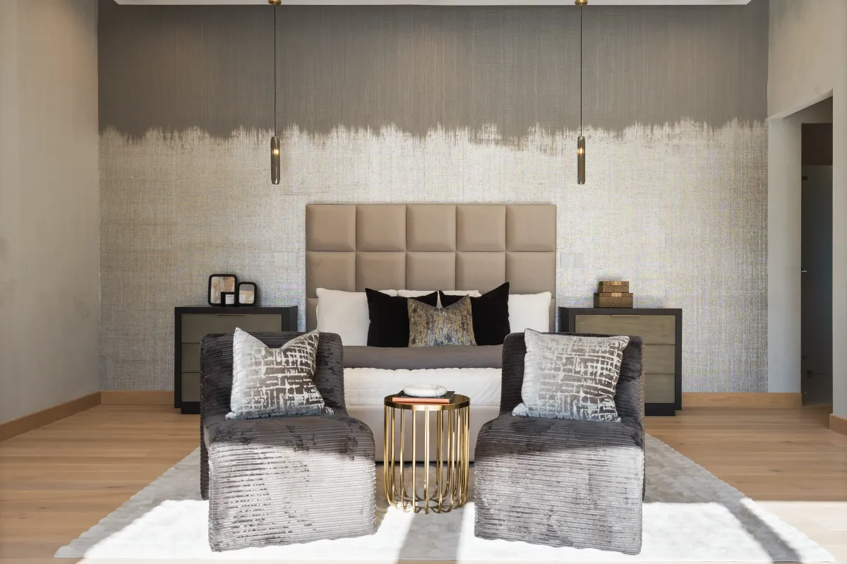 Spacious luxury primary bedroom featuring a modern accent wall and elegant staging that highlights the room’s size and design, styled by Model My Home—Dallas Fort Worth home staging experts.