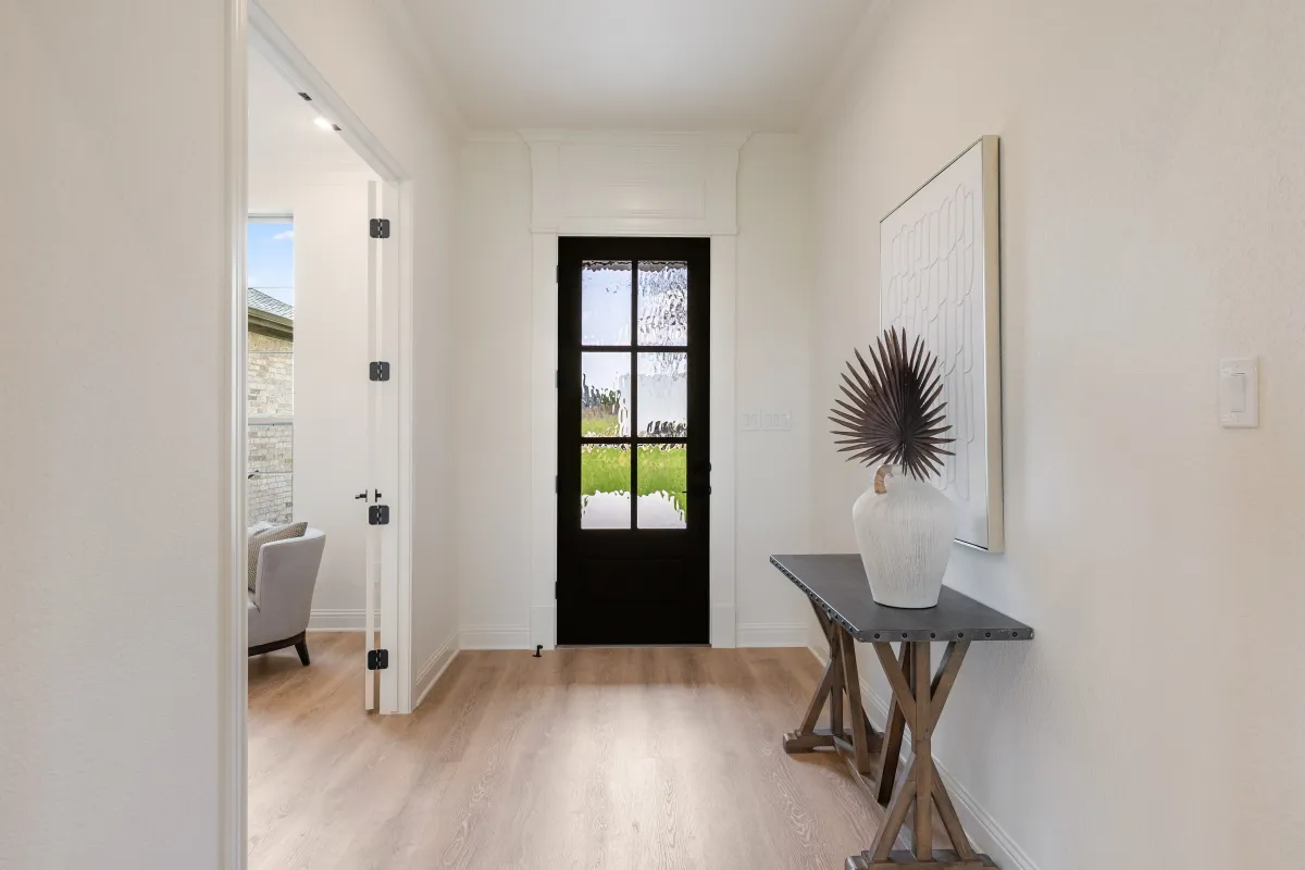 Spacious entryway opening into a wide hall and open-concept home, professionally staged by Model My Home—Dallas Fort Worth home staging and interior design experts.