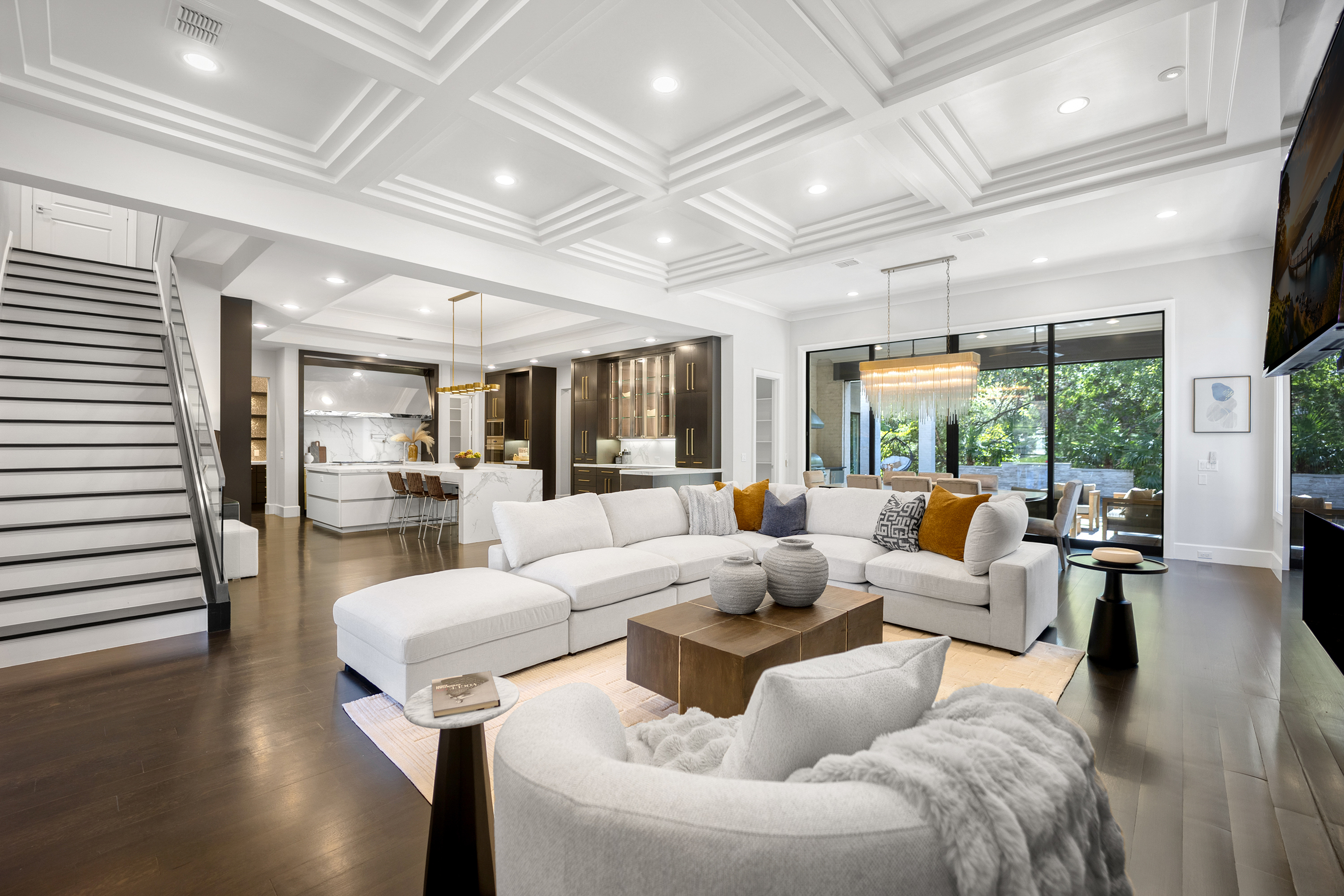 Large, spacious open-concept living room featuring ceiling built-ins as a custom accent, professionally staged by Model My Home—Dallas Fort Worth home staging and design experts.