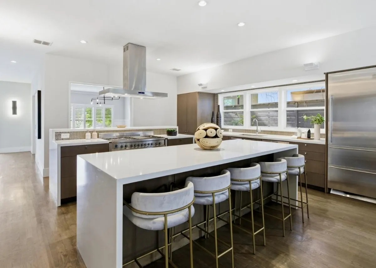 Large modern staged kitchen with a spacious island and open-concept design, professionally styled by Model My Home—Dallas Fort Worth home staging and interior design experts.