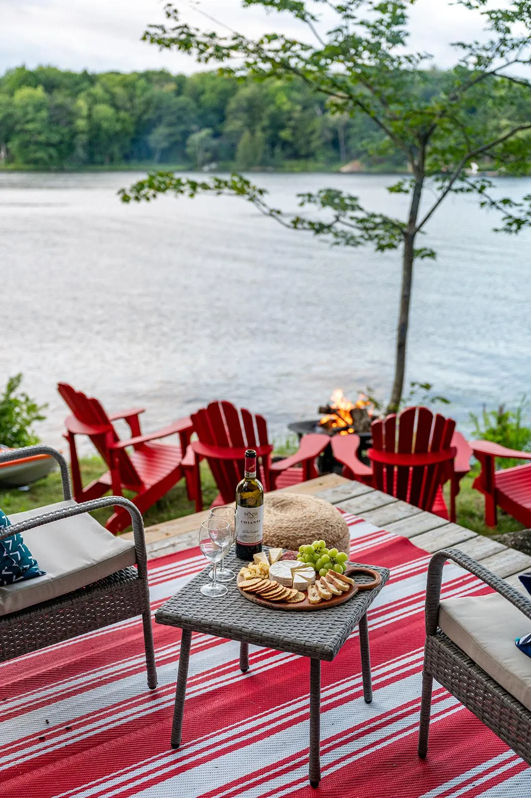 a body of water surrounded by trees and houses