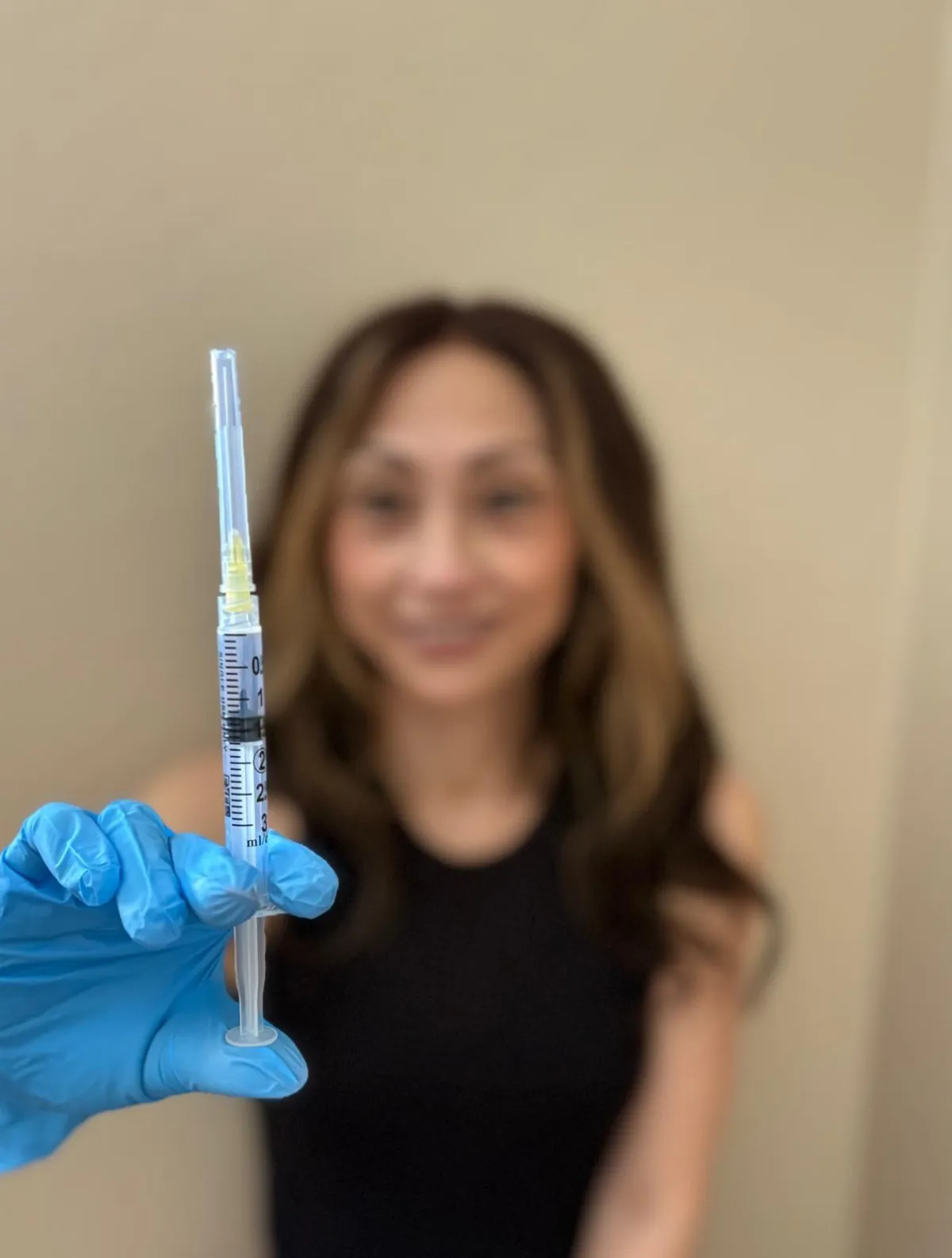 NAD+ vial held by a person, emphasizing Nicotinamide Adenine Dinucleotide for IV infusion therapy, promoting cellular health and recovery.