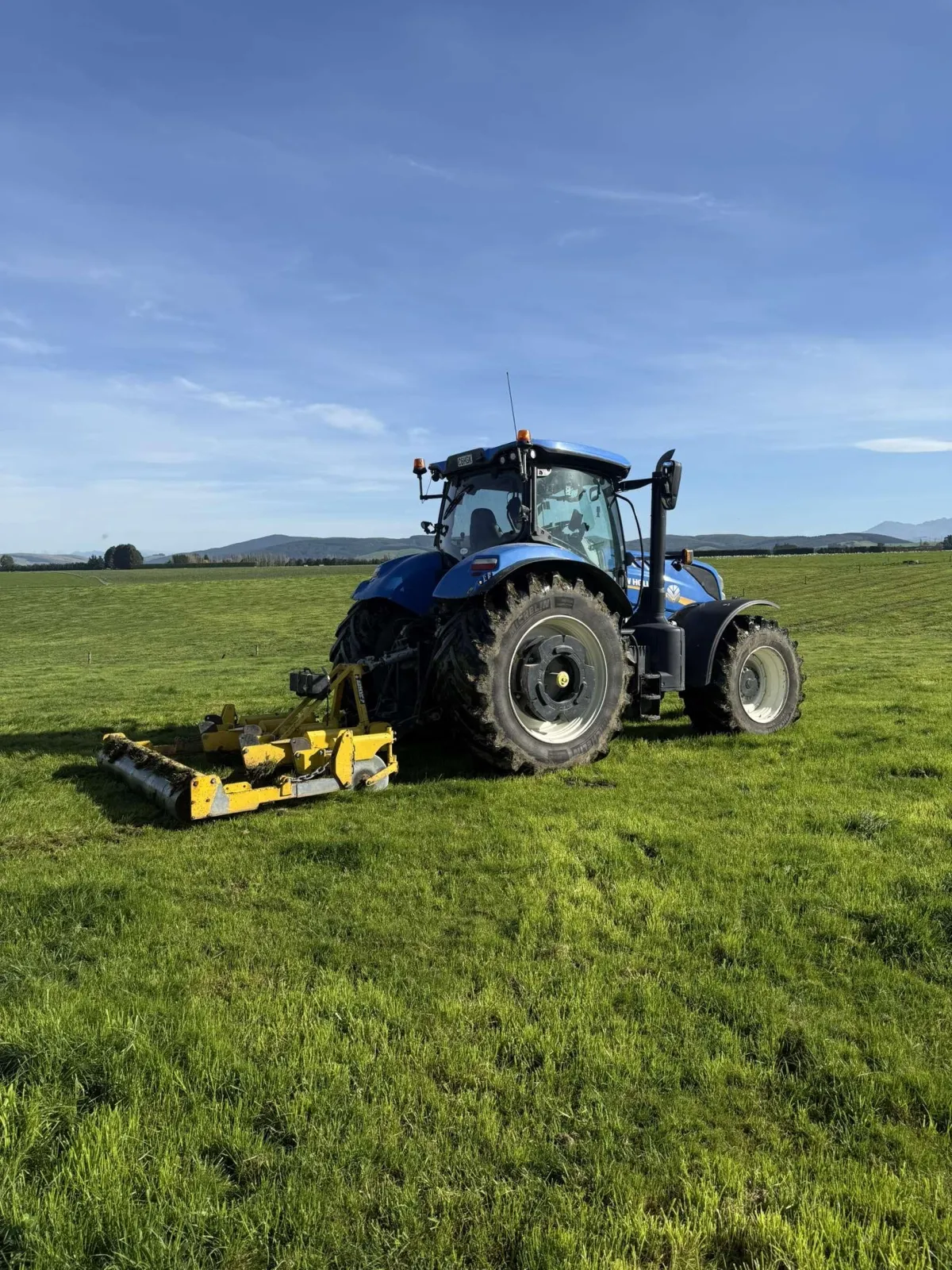 Fresh tyre tracks across a prepared paddock after muck spreading