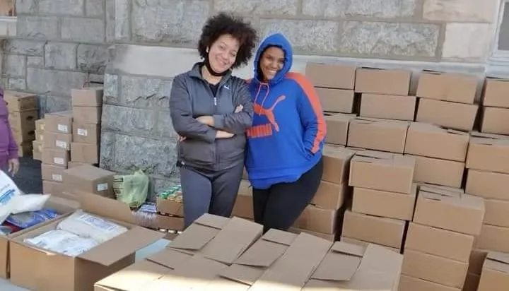 woman in white long sleeve shirt using black laptop computer