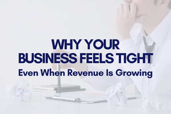 Business professional sitting at a desk with crumpled papers, looking stressed, with text overlay.