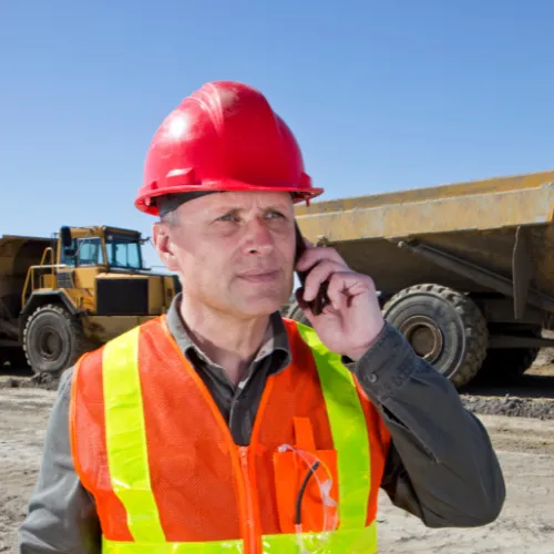 Tom Reynolds, contractor, using his phone to demo his mobile-friendly roofing website