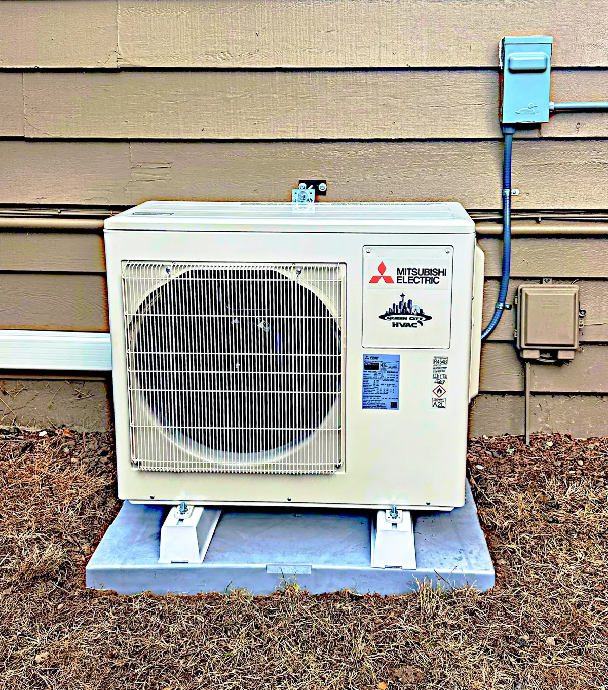 Technician servicing a residential gas and electric furnace in the Puget Sound Region