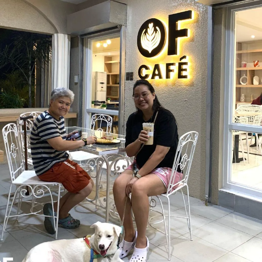 Warm interior of Our Father’s Café with morning light, wooden tables, and a welcoming atmosphere