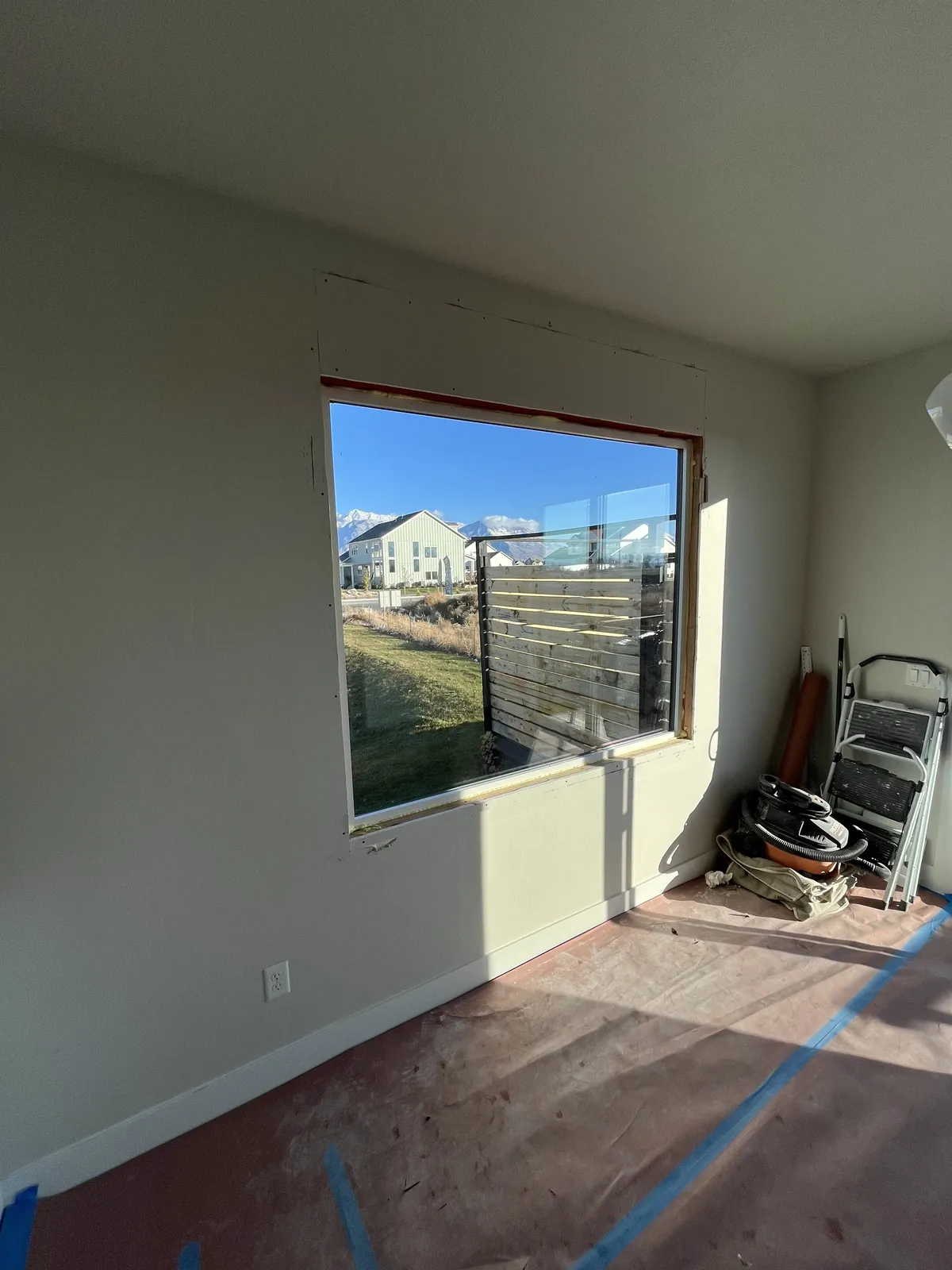 Large picture window newly installed in an interior wall