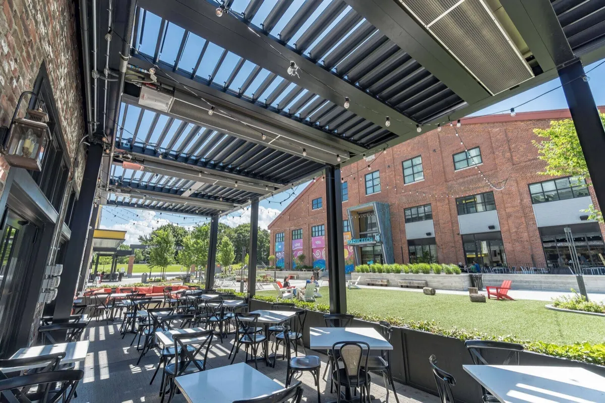 Motorized louvered roof with evening lighting