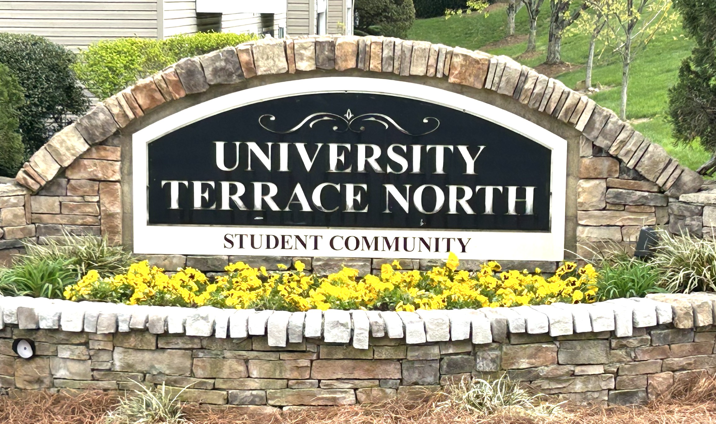 living room with brown sofa and glass window