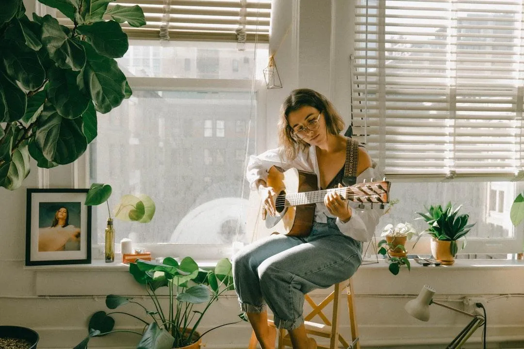 Girl playing acoustic guitar