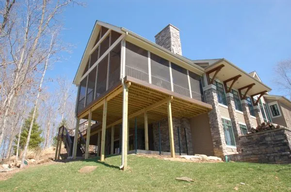 Tiered deck built on a sloped Colorado backyard with mountain views