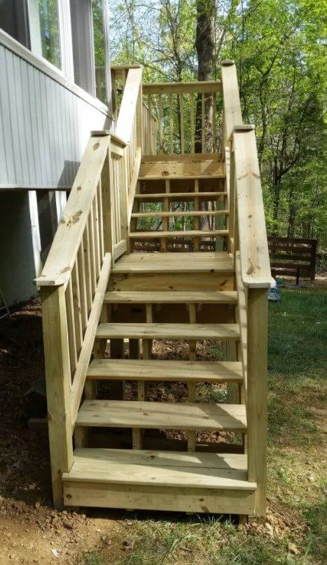 Contractor replacing damaged deck boards on a Colorado home