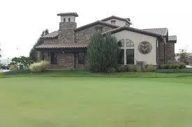 Multi-level deck with outdoor kitchen in Harmony Club Fort Collins