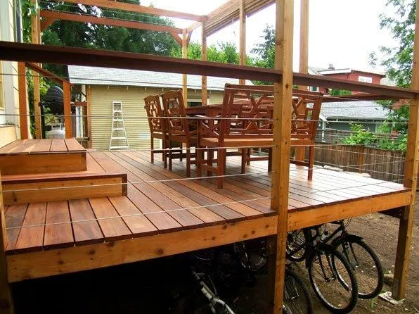 Pressure-treated wood deck with railings overlooking a Colorado backyard