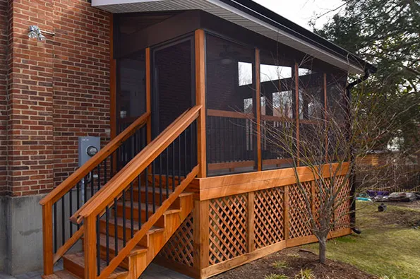Screened-in porch with wood framing and durable mesh on Colorado home