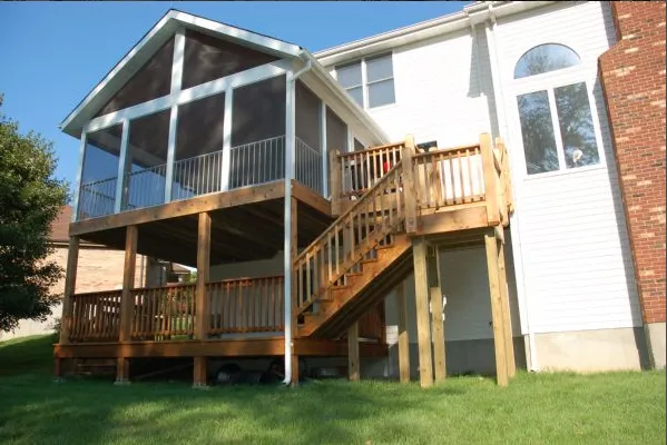 Multi-level deck with outdoor kitchen and lounge seating in Colorado