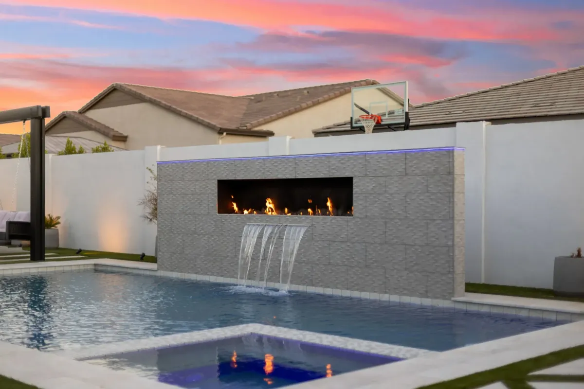 a large body of water surrounded by a lush green forest