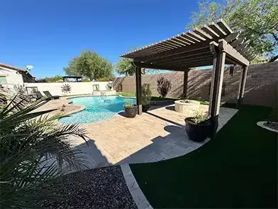 A swimming pool with a tiled floor and blue water