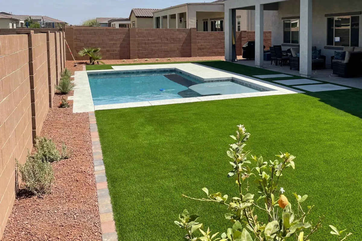 an aerial view of a pool and patio area