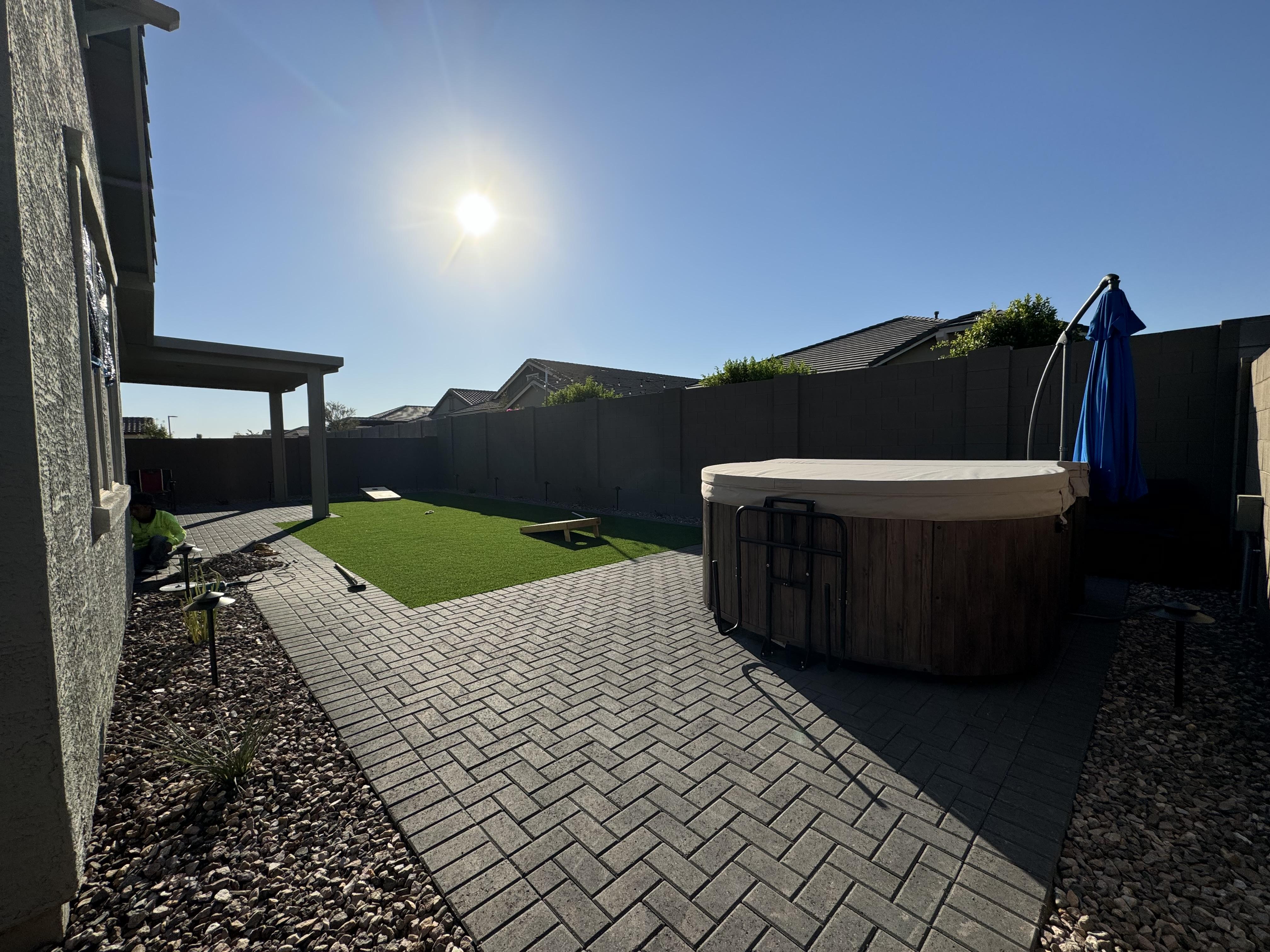 an aerial view of a pool and patio area