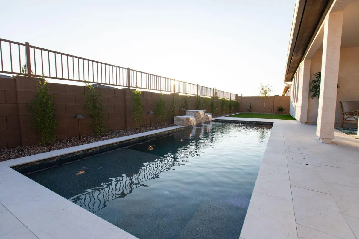 an aerial view of a pool and patio area