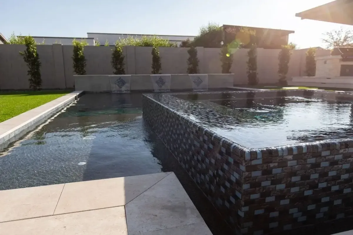 green trees near swimming pool during daytime