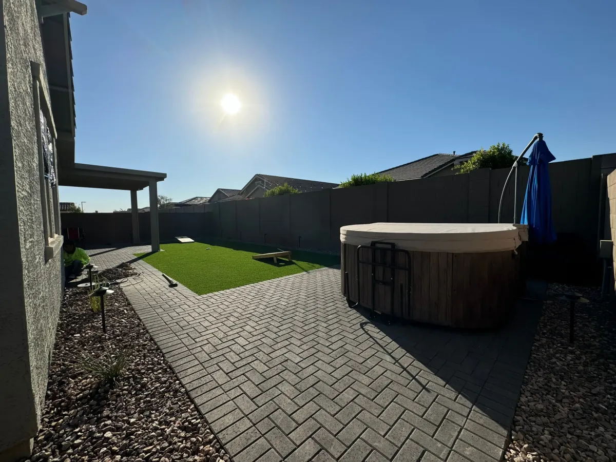 an aerial view of a pool and patio area