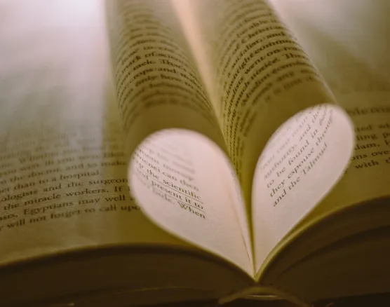 Heart formed by Bible pages representing personal connections