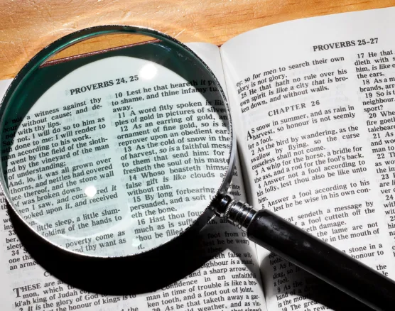 Magnifying glass over scripture text
