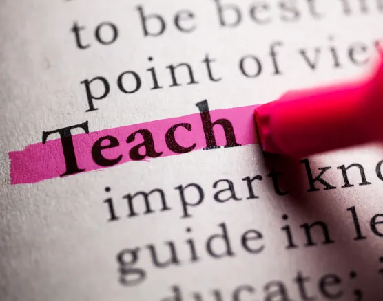Word "Teach" highlighted in text