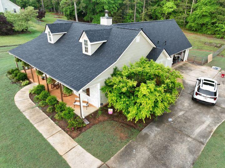 Residential fascia and soffit upgrade in Stockbridge, Georgia by Elite Roofing & Outdoor Construction — moisture control and ventilation solution