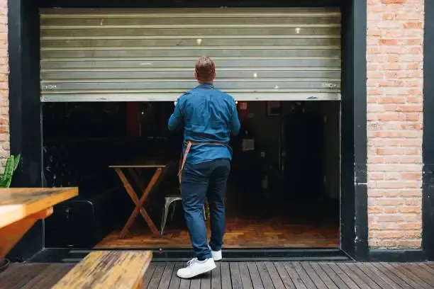 human hand holding money bills