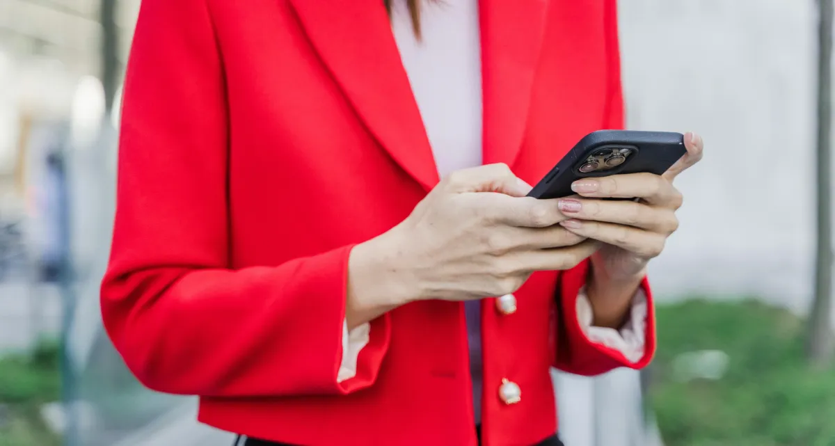 Health and wellness coach on her phone converting Instagram DMs into booked consultations — Client Flow Framework by Shapei Tragico