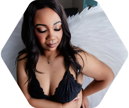 A woman in black lingerie poses for a boudoir shoot in Indianapolis at Enchanted Moments Artistry