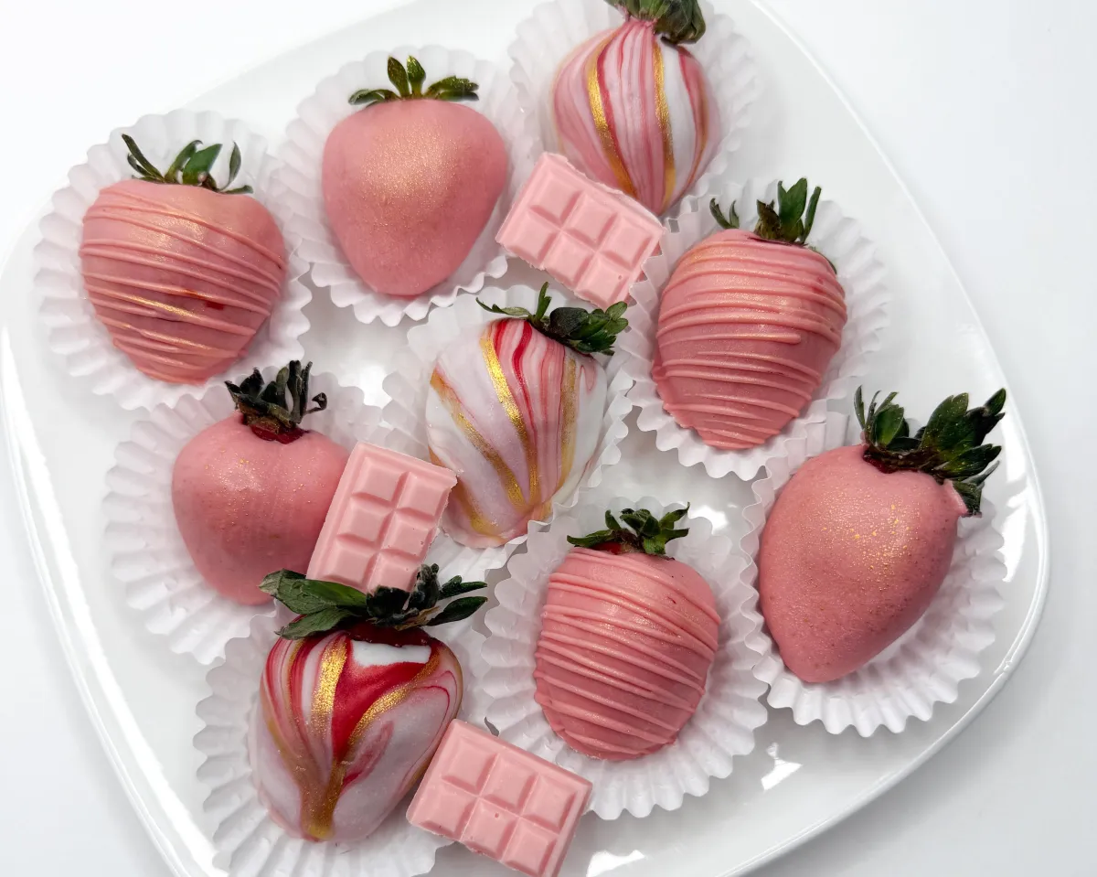 luxurious, decorative white-chocolate dipped strawberries in pink and gold