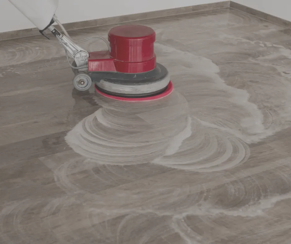 carpet cleaner buffing a hardwood floor