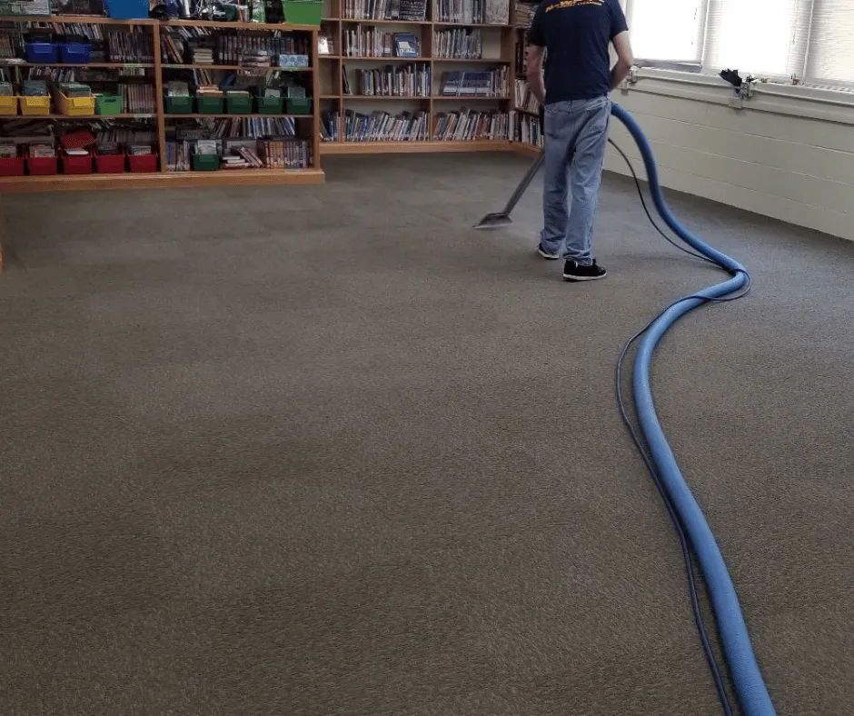 New Way carpet cleaning technician vacuuming high traffic carpets