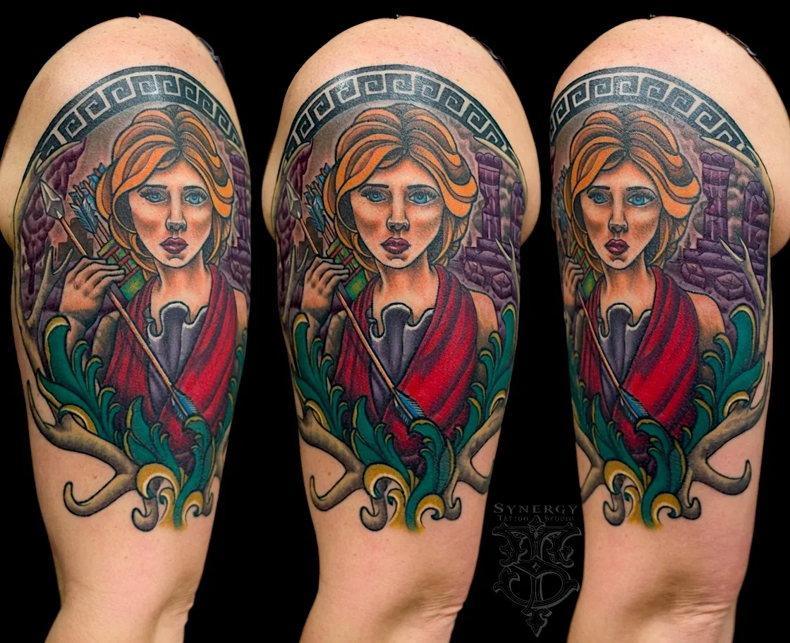 Color woman’s portrait tattoo with a headscarf, flowers, and a dark bird