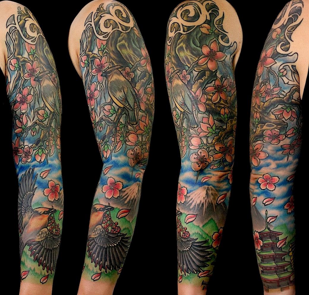 Color Japanese-style tattoo sleeve with birds, flowers, and flowing background details