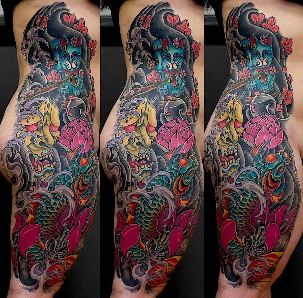 Color tattoo sleeve with a skull, koi, pink flowers, and swirling water