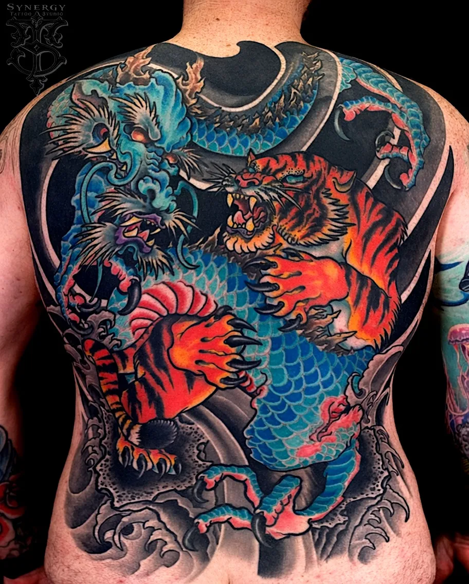 Color owl and fox tattoo framed by leaves and red berries