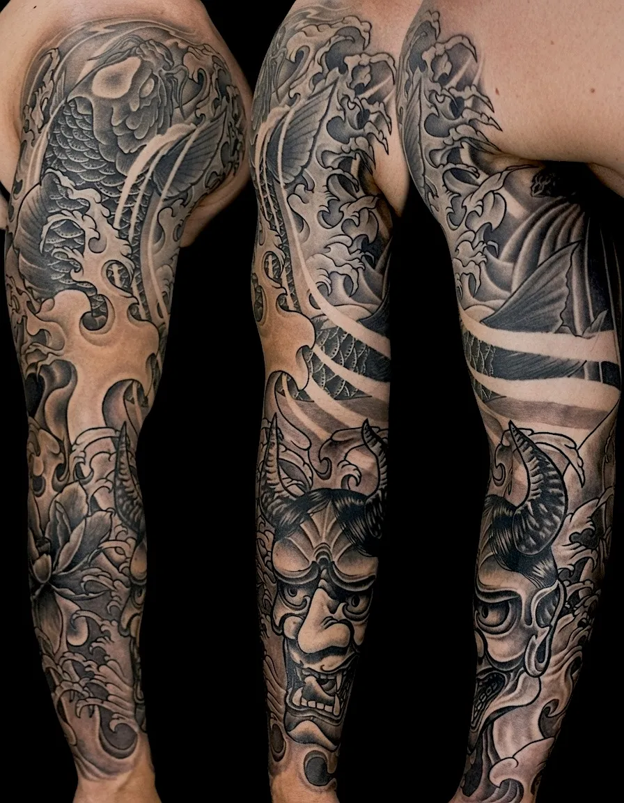 Black and grey Japanese-style tattoo sleeve with koi, flowers, and flowing ornamental shapes