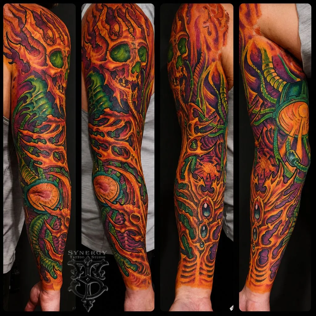 Color bio-organic skull tattoo sleeve with orange flames and green details
