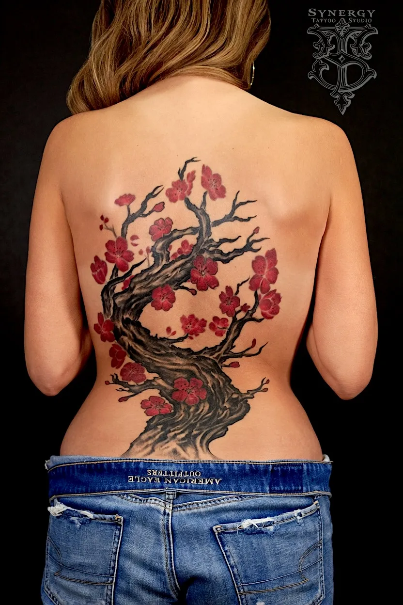 Cherry blossom tree tattoo extending across the back
